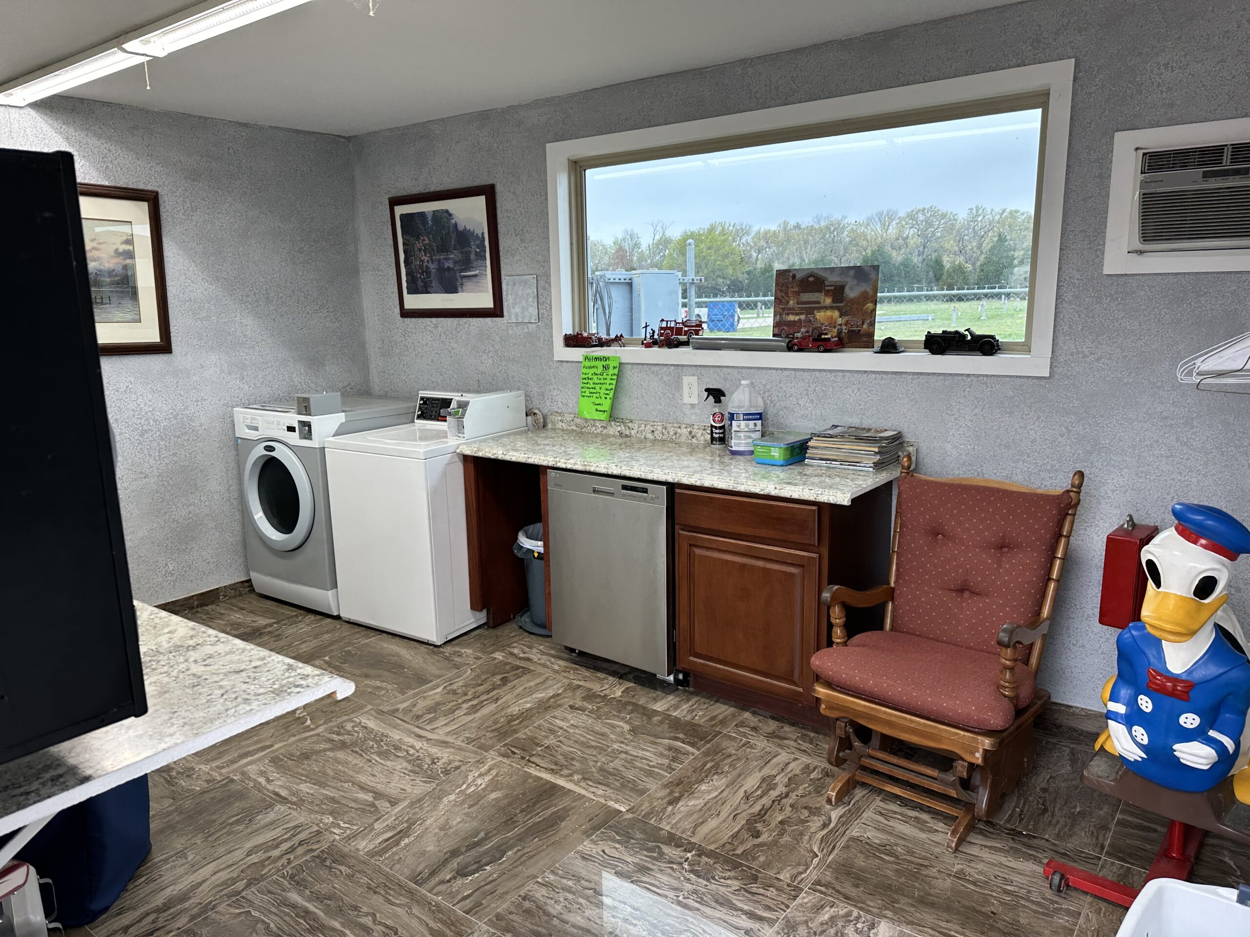 A Laundry Room With A Washing Machine Inside The RV