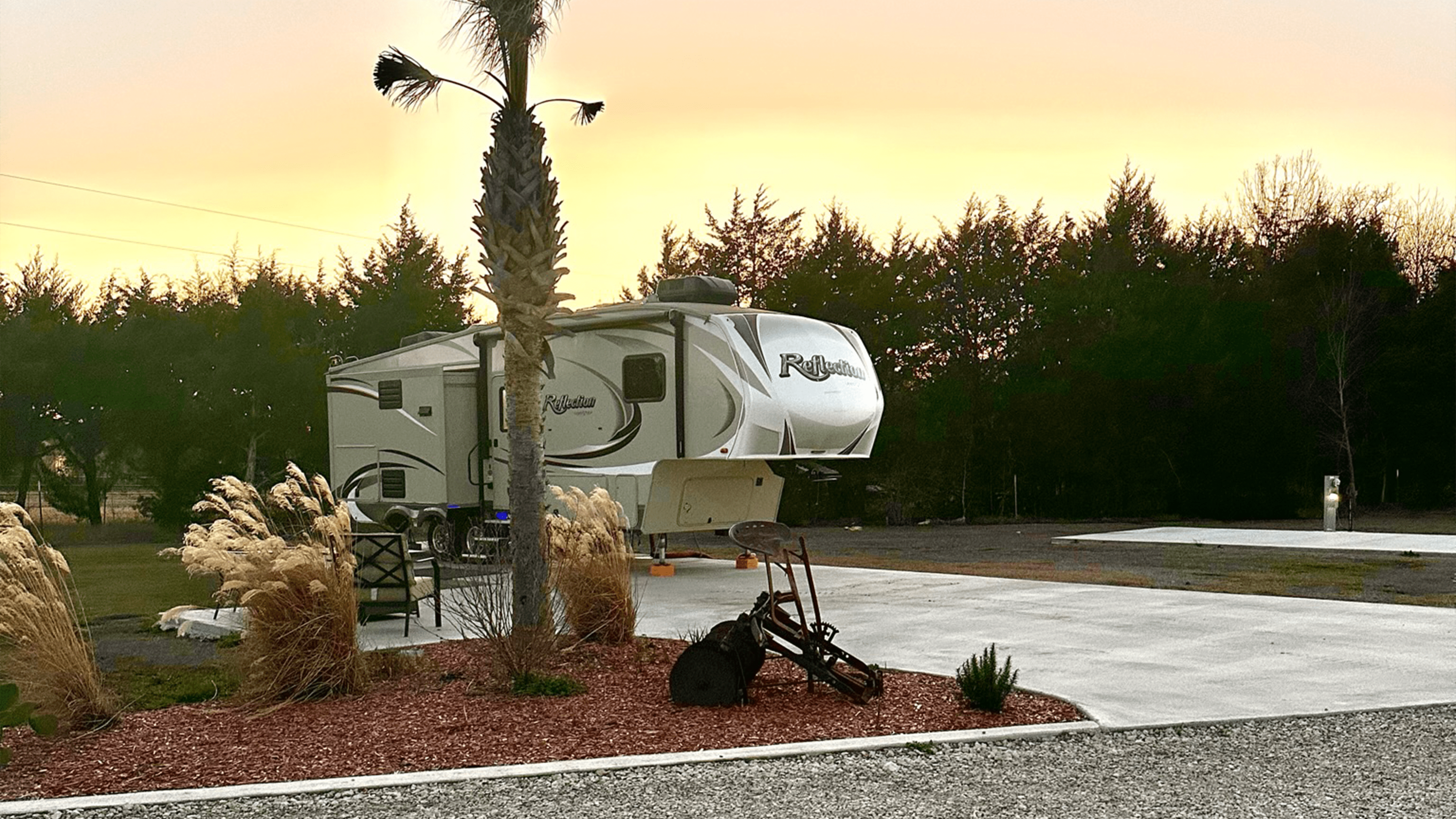 An RV Parked In An Open Space Area